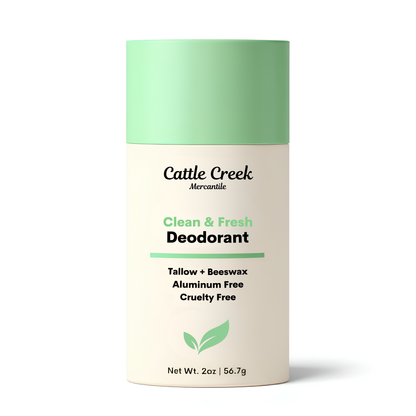 Cattle Creek Mercantile deodorant tube with green cap and white body on a white background